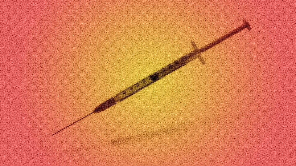 A blurred vaccine syringe