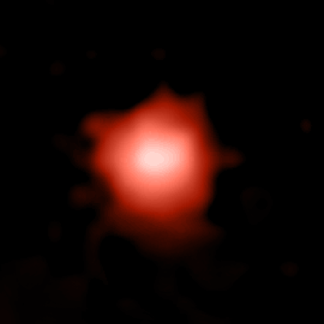 A picture of a red blob against inky darkness—a distant galaxy captured by the James Webb Space Telescope