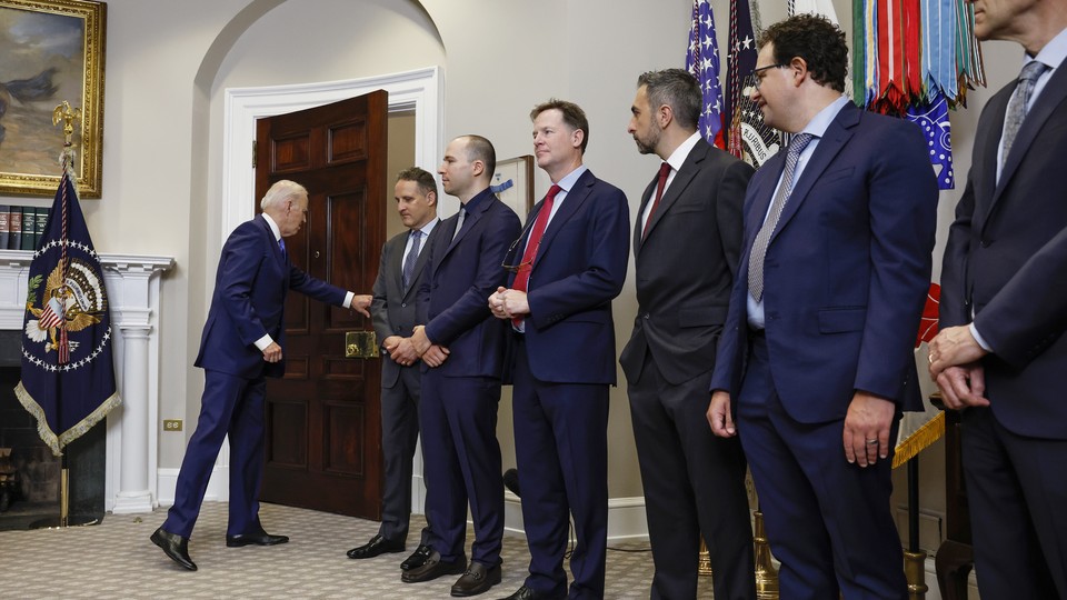 Seven leaders of AI companies and President Biden in the Roosevelt Room of the White House