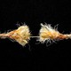 Graphic illustration of two hands pulling a rope in opposite directions, to the point that the thinned rope is about to snap.