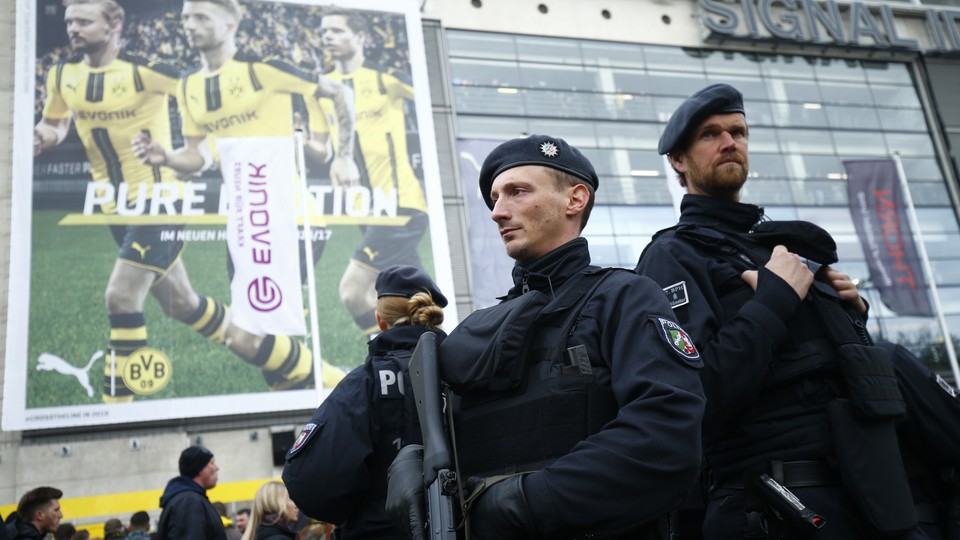 A view of security guards outside the stadium before the match between Borussia Dortmund and Eintracht Frankfurt.