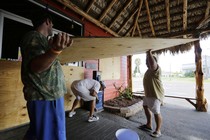 Business owners in Port Aransas, Texas, board up in expectation of Hurricane Harvey.