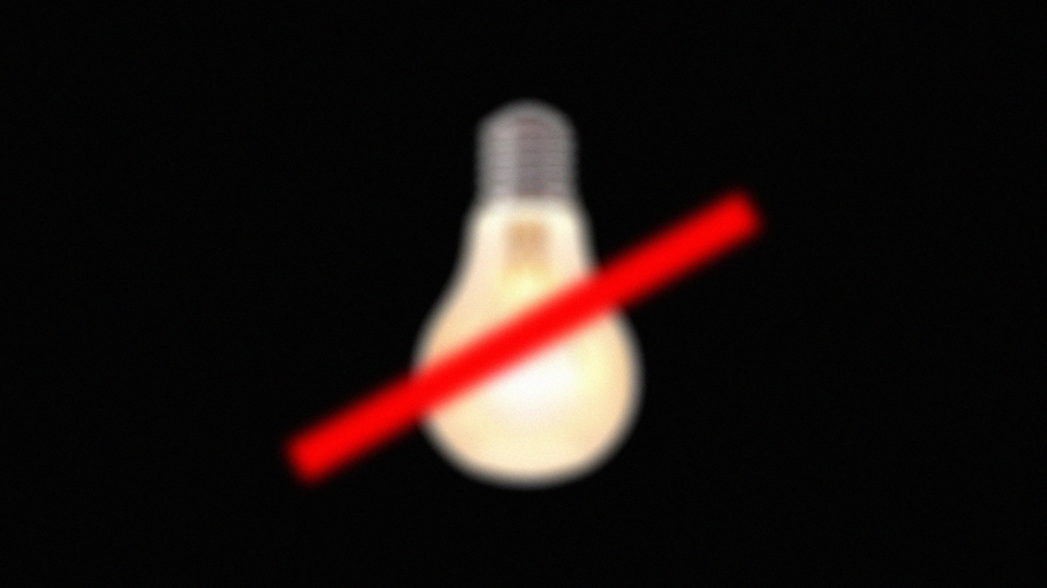 Illustration of a light bulb with a red mark through it.