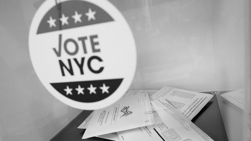 A black-and-white photograph of ballots and a Vote NYC sticker