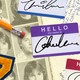 A collage of a yearbook with name tags and signatures