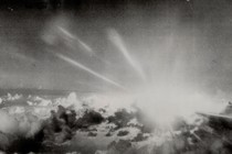 A black and white image of the sky with clouds