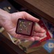 Picture of a person holding a paperweight