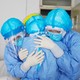 Health workers hugging in Zouping, China