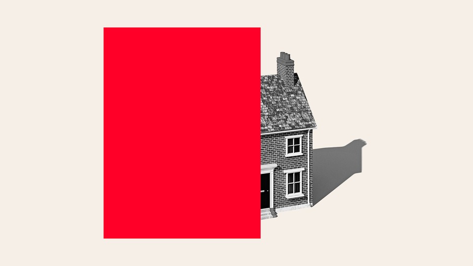 a house half-covered by a red box