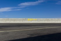 A highway rest stop that has a "Exit" sign