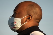 Jaime Harrison in profile, wearing a mask