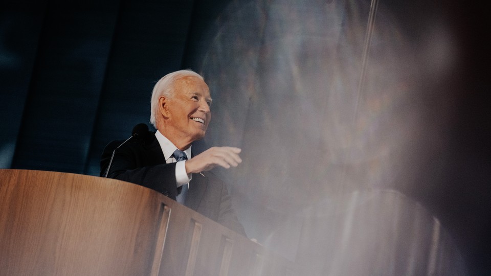 Joe Biden smiling onstage at the DNC