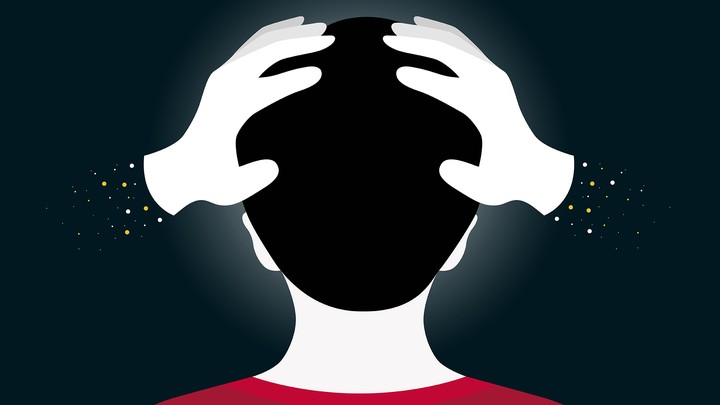 An illustration of hands squeezing a child's head