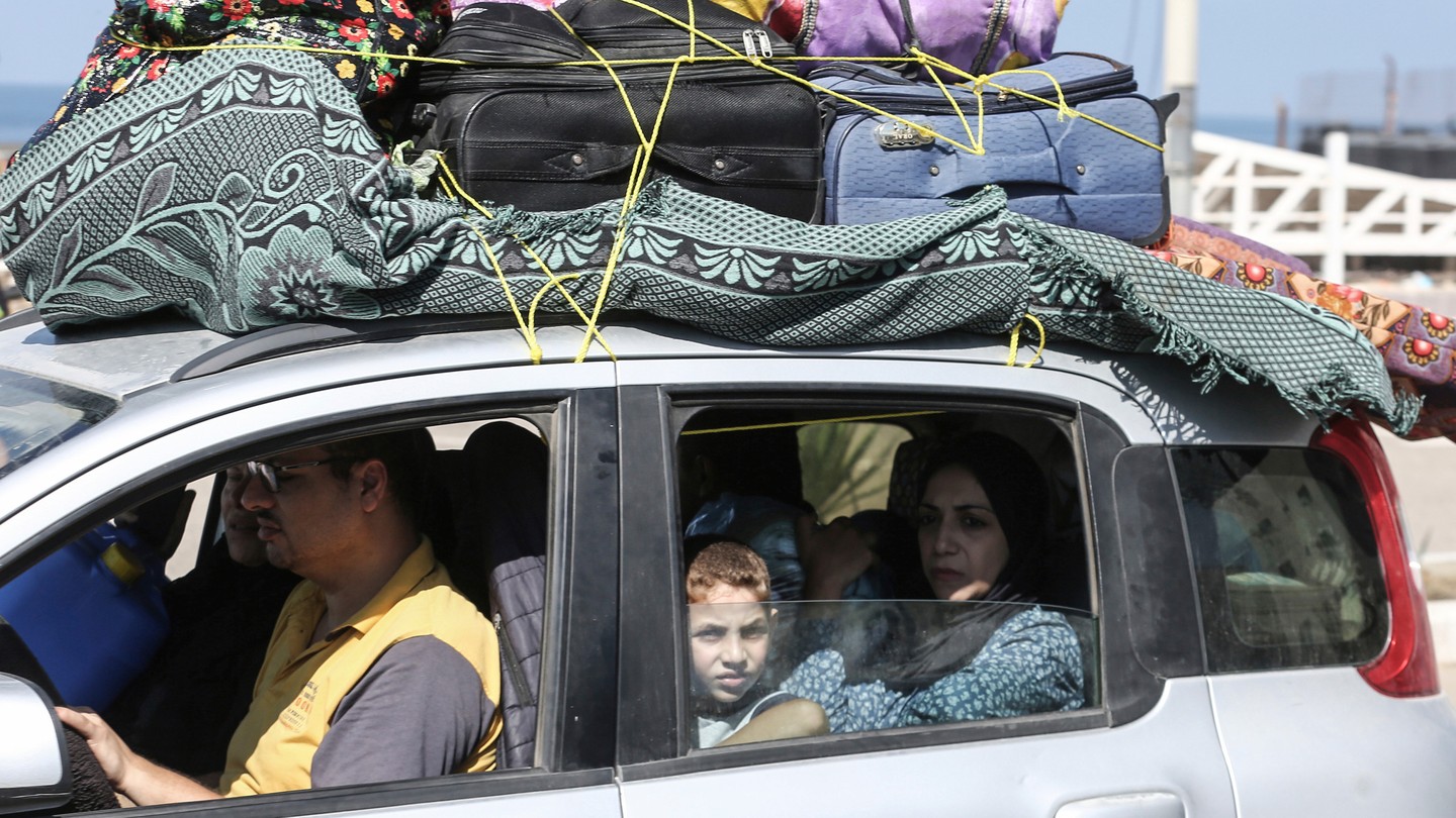 Picture of Palestinians fleeing to safer areas following Israeli air strikes