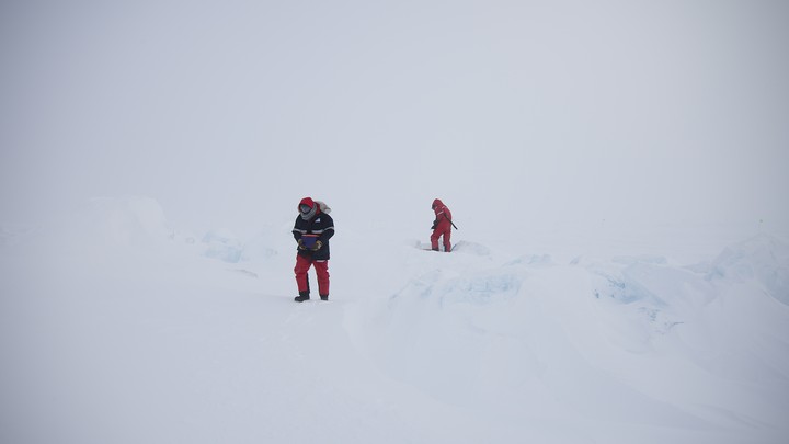 Alexey Niubom (right) doing a battery exchange in the field in early April