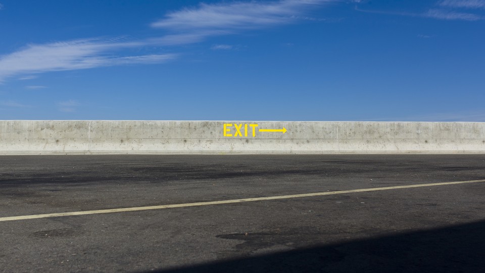 A highway rest stop that has a "Exit" sign
