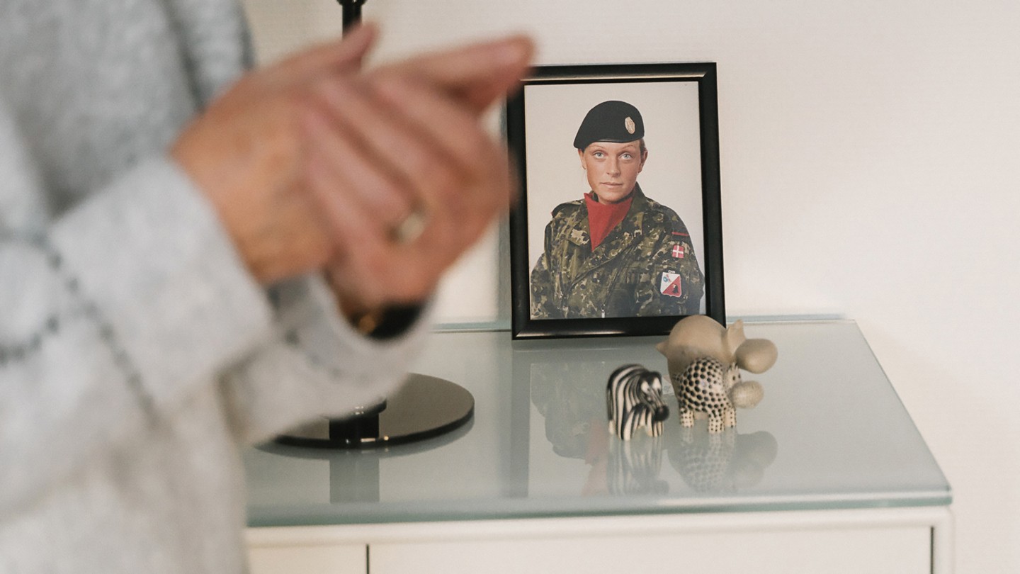 a color photograph of  Sophia Bruun sits on a table in a black frame