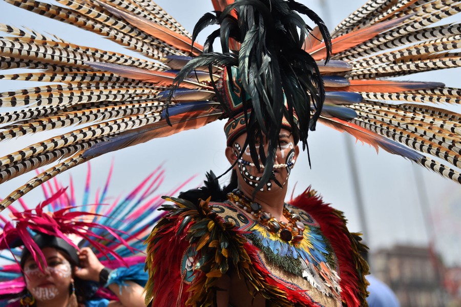 Indigenous people take part in an anniversary event.