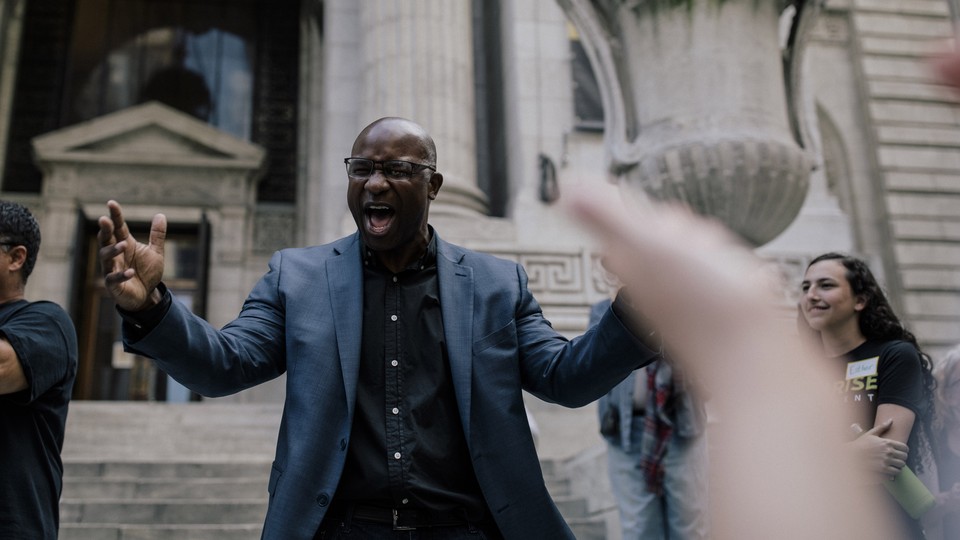 Jamaal Bowman speaks to a crowd during a rally in New York City