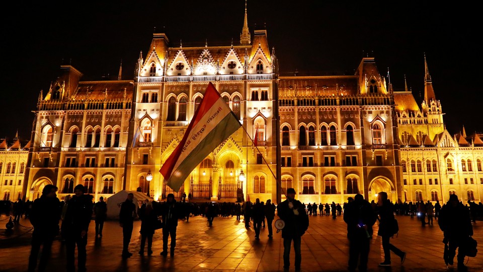 Opponents of Hungary's new labor law demonstrate in front of the Parliament building in Budapest in December.