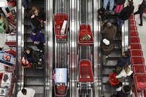 Shoppers ride an escalator in a Target store in Chicago