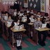 A group of students sits in a parochial-school classroom
