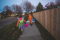 A halloween party with several characters standing around in different meme costumes. Stonks guy, Brat Summer, Doge, Distracted Boyfriend and Dancing Baby are in attendance.