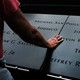 A man reflects on the names inscribed at the September 11 memorial in Lower Manhattan.