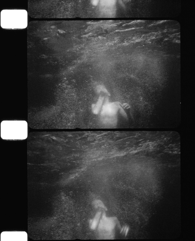 BW image of a boy underwater