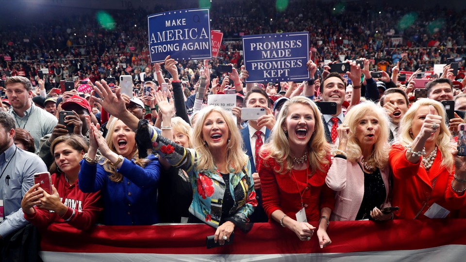 Trump supporters participate at a campaign rally in Charlotte, North Carolina on October 26, 2018.