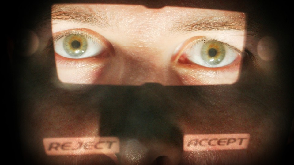 A close-up of a man's face with the eyes illuminated and the words "reject" and "accept" superimposed on his cheeks