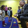 New York City Mayor Bill de Blasio smiles at children in a pre-k classroom in Brooklyn.