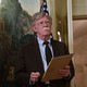 John Bolton holding a legal pad