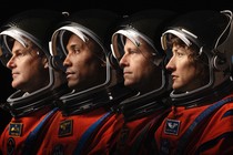 The faces of the crew of the Artemis 2 mission in profile, helmets on, from left to right: Jeremy Hansen, Victor Glover, Reid Wiseman, and Christina Koch