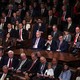 Kevin McCarthy sits in a sea of seated representatives.