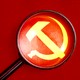 An illustration of a looking glass hovering over a Soviet hammer-and-sickle symbol