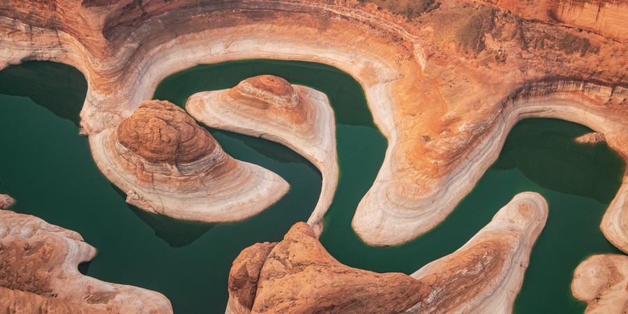 An aerial view of the water-filled valleys of a canyon