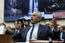 RFK Jr. gestures behind a desk