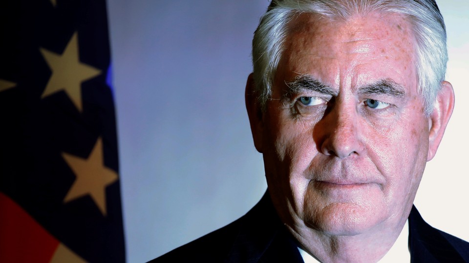 Rex Tillerson in front of an American flag
