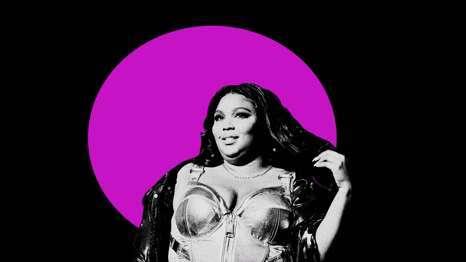 Black-and-white photo cutout of Lizzo against a black background with a fuchsia circle in the center