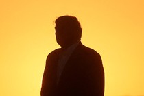 A photo of Trump's silhouette against a yellow background