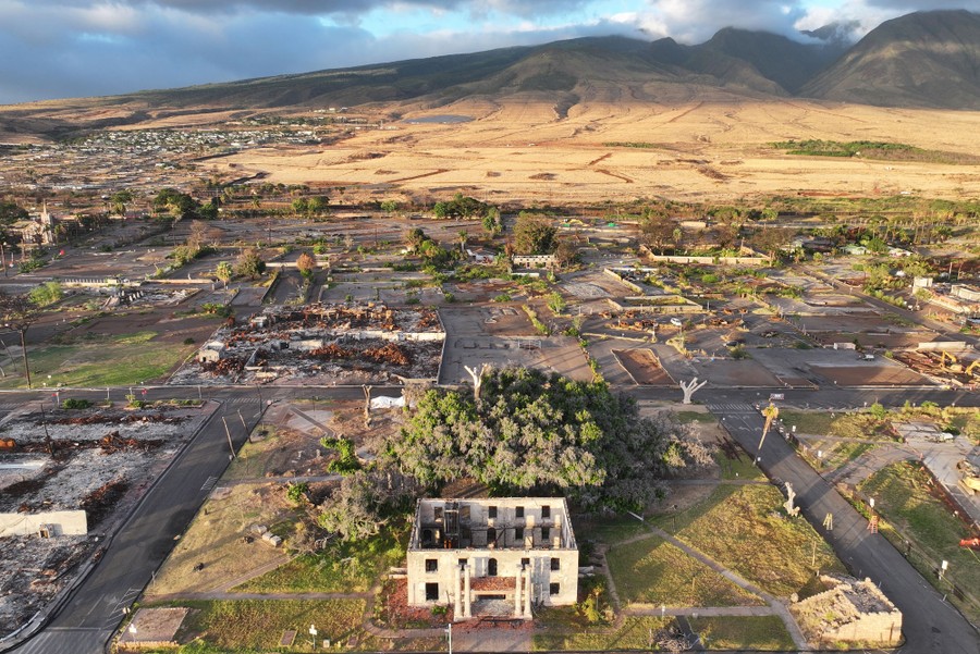 An aerial view of the ruins of part of a small town.