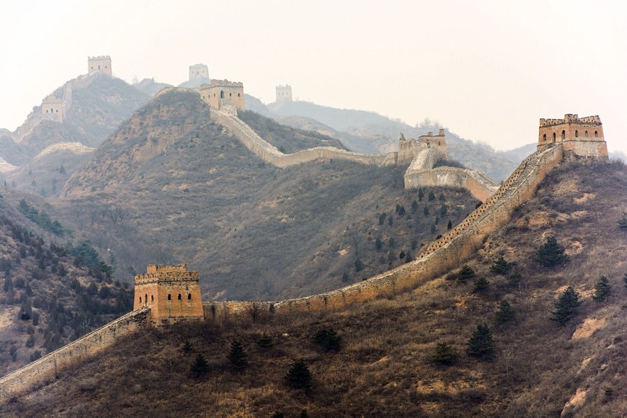 A section of the Great Wall of China climbs through mountainous territory, connecting numerous hilltop watchtowers.