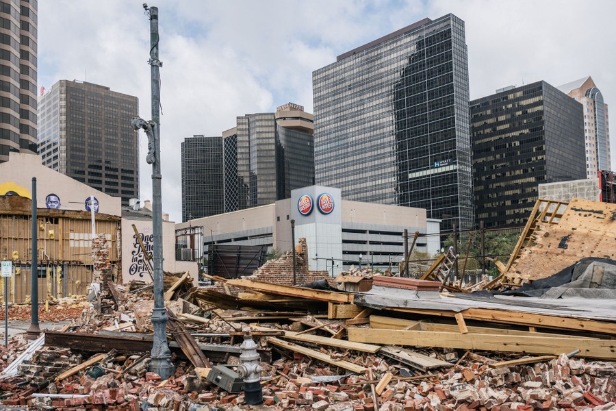 A pile of wood and bricks sits where a building once stood in downtown New Orleans.