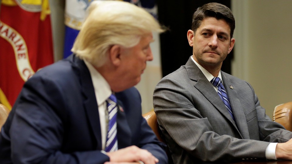 House Speaker Paul Ryan and President Trump sitting at a table during a meeting.