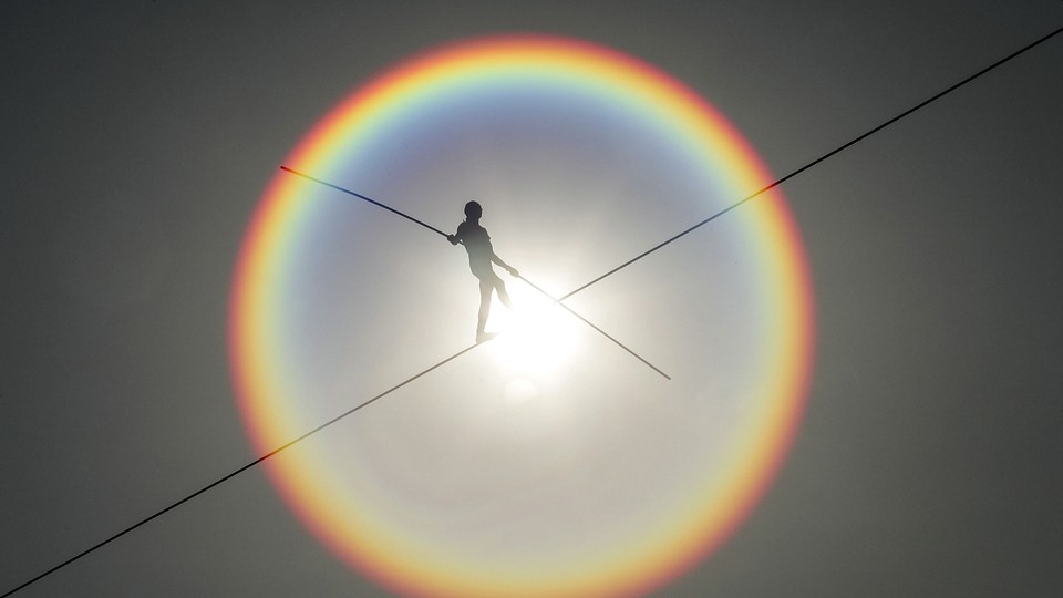 A person walking a tightrope