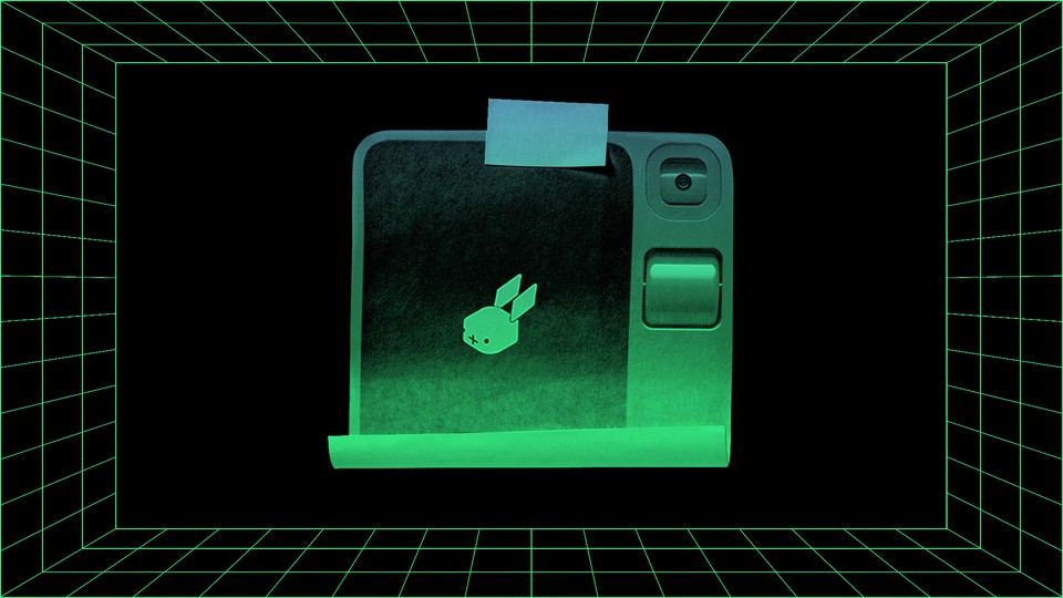 Illustration of an image of the Rabbit R1 printed on a piece of paper and stuck with tape onto a background