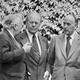 Gerald Ford, Harold Wilson, Valery Giscard d'Estaing, and Helmut Schmidt speaking with each other