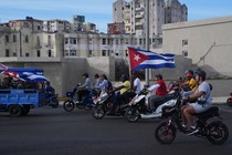 Motorcycles in Cuba holding the flag