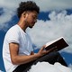 An AI-generated image of a man reading a book